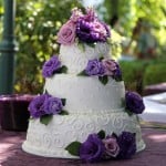 wedding cake white purple flowers round