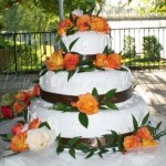 wedding-cake-brown-ribbon-orange-flowers
