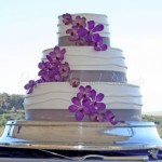 wedding-cake-stand-purple-flowers-outdoors