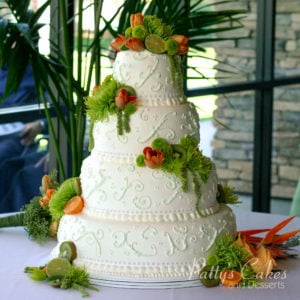4 tier white wedding cake orange fruit