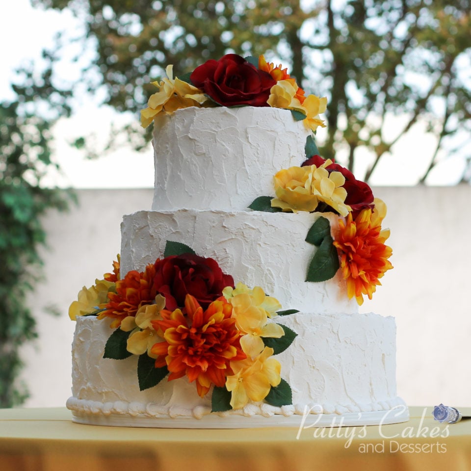 rustic wedding cake colorful flowers