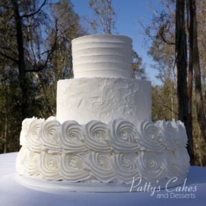 white rosette wedding cake