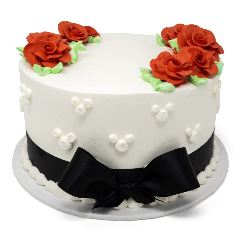 white cake black bow red flowers cake